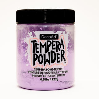 DecoArt tempera powder paint in vibrant purple, shown in a container with the powder visible on a craft table.