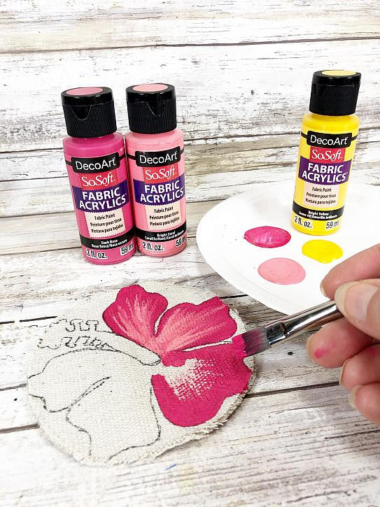 DecoArt SoSoft Fabric Paint in cadmium orange, 1oz bottle, suitable for soft fabric designs and craft projects.