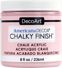 DecoArt Americana Decor Chalky Finish 8oz paint jar with white chalky finish on a rustic wooden surface