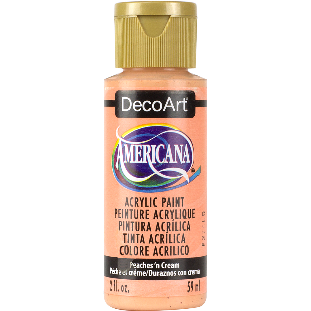 DecoArt Americana Acrylics Oranges paint bottle labeled Peaches 'n Cream, 2 oz, with orange color swatch and product label visible.
