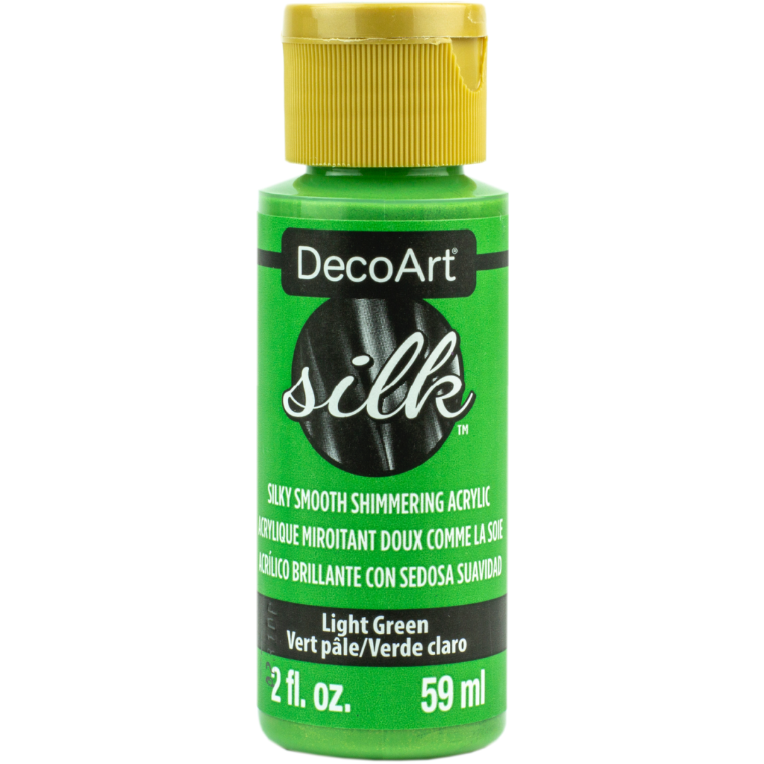 DecoArt Silk Rose fabric paint bottle, 2 oz, with vibrant pink color and smooth silk finish for crafting and decorating projects.