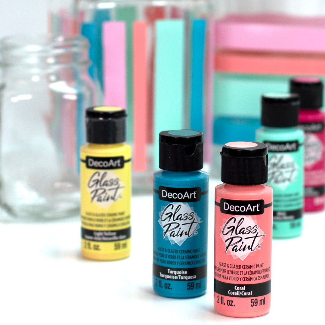 White DecoArt Glass Paint in a 2 oz bottle, suitable for decorating and customizing glass surfaces.