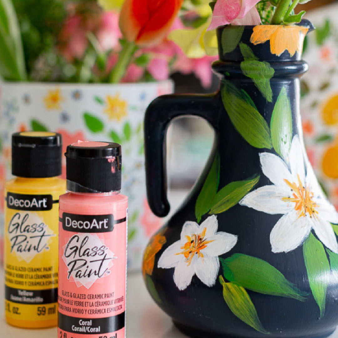 White DecoArt Glass Paint in a 2 oz bottle, ideal for decorating and customizing glass surfaces with vibrant color.